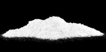 Pile of white snow on a black background. Snow hills. Christmas.の写真素材