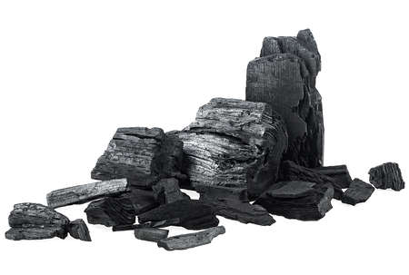 Pile of natural wood charcoal isolated on a white background. Pieces of charcoal. Traditional charcoal.の写真素材