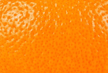 Ripe orange peel, as background. Close up view. Macro.の写真素材
