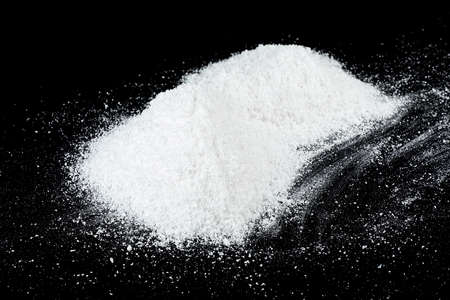 Pile of white snow isolated on a black background. White snow at night.の写真素材