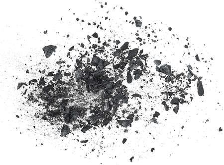 Black dust powder of charcoal with fragments on a white background, top view.の写真素材
