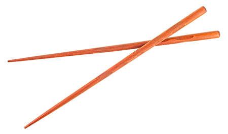 Wooden chopsticks isolated on a white background, top view. Pair of brown chopsticks.の写真素材