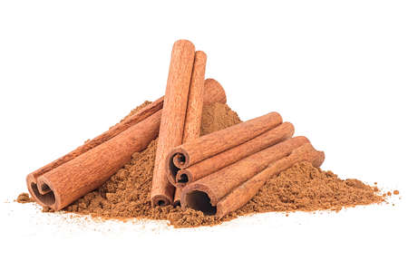 Cinnamon sticks with cinnamon powder isolated on a white background. Aromatic cinnamon sticks.の写真素材