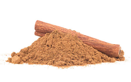 Aromatic cinnamon stick and cinnamon powder isolated on a white backgroundの写真素材