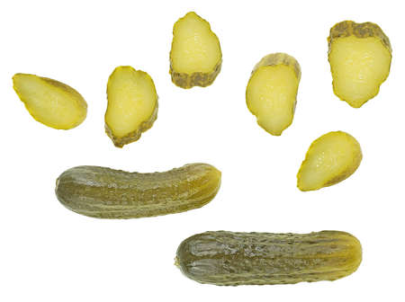 Delicious marinated pickled cucumbers isolated on a white background, top view. Pickled cucumbers and slices.の写真素材