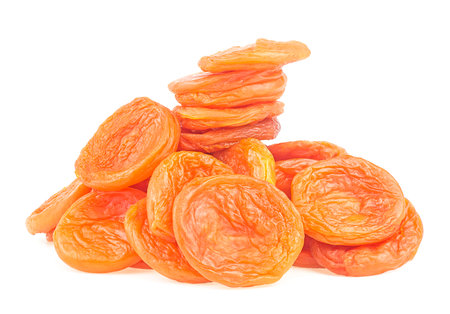 Heap of dried apricots isolated on a white background. Health food.の写真素材