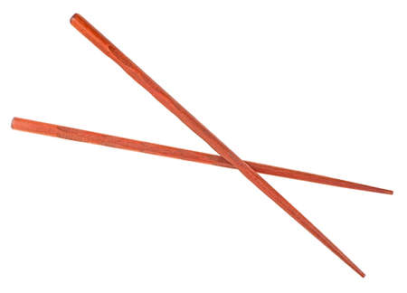 Wooden chopsticks isolated on a white background, top view. brown color.の写真素材