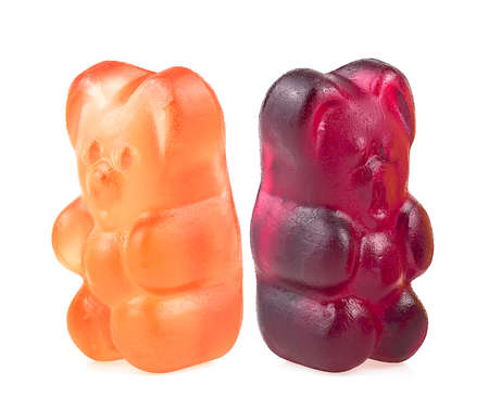 Two jelly marmalade bears isolated on a white background. Colorful fruit gummy candies.の写真素材