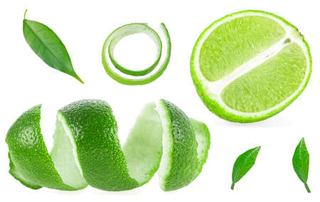 Lime fruit isolated on a white background - lime slice, zest of lime and leaves of lime tree.の写真素材