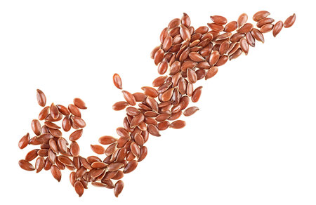 Brown flax seeds isolated on a white background, top view.の写真素材