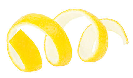 Lemon peel isolated on a white background, close-up. Lemon twist or lemon zest.の写真素材