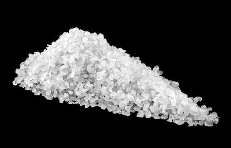 Heap of sea salt isolated on black background. Crystals of white salt.の写真素材
