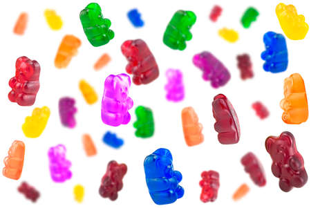 Falling colorful jelly bears isolated on a white background. Jelly gummy candies.の写真素材