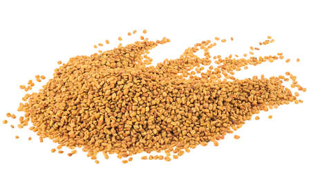 Pile of dried fenugreek seeds isolated on a white backgroundの写真素材