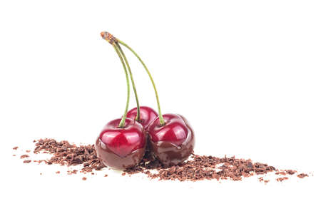 Ripe fresh red cherries in chocolate isolated on a white backgroundの写真素材
