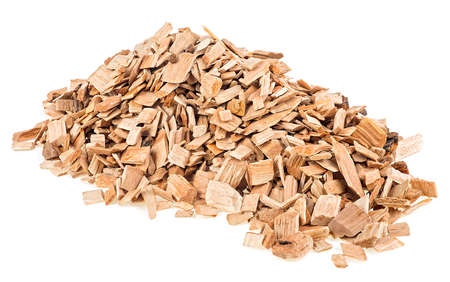 Pile of wood chips isolated on a white background. Wood chips for smoking, BBQ or recycle.の写真素材