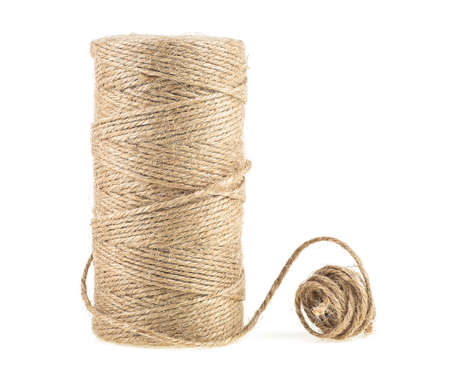 Brown thread twisted into a spool isolated on white background. Natural rope, hemp cord.の写真素材