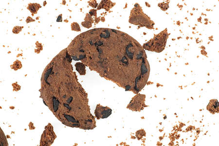 Tasty chocolate chip cookie with chocolate chips and crumbs isolated on a white backgroundの写真素材