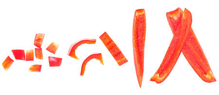 Different shapes and sizes of red sweet bell pepper slices isolated on a white background, top view.の写真素材