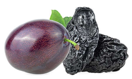 Fresh plum and prunes with green leaves isolated on a white background. Health food.の写真素材