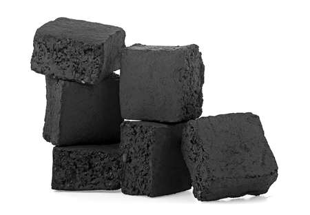 Group of charcoal cubes isolated on a white background. Coconut coal for a hookah.の写真素材