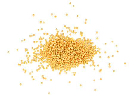 Pile of yellow mustard seeds isolated on a white background, top view.の写真素材