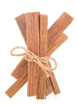 Sandalwood sticks tied with rope isolated on a white backgroundの写真素材