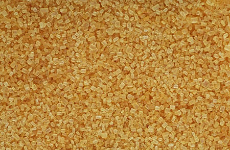 Raw unrefined cane sugar, top view. Brown sugar texture as background.の写真素材