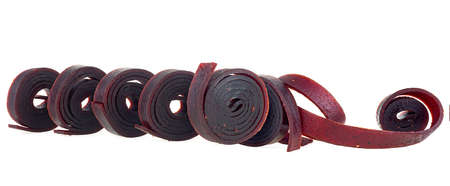 Natural and healthy snack food - fruit pastille from apples, raspberry and currant on a white background.の写真素材