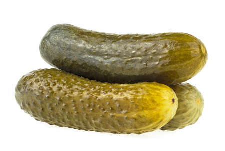 Three marinated pickled cucumbers isolated on a white backgroundの写真素材