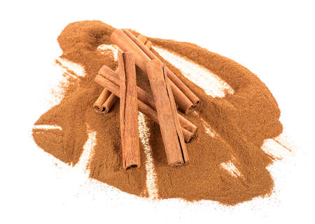 Aromatic cinnamon sticks and powder isolated on a white background. selective focus.の写真素材