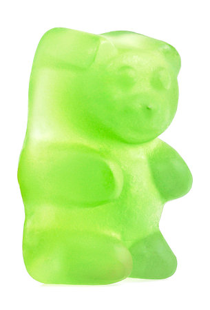 Green jelly gummy bear isolated on a white backgroundの写真素材