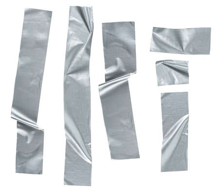 Pieces of silver self-adhesive construction tape isolated on a white background, top view. Metallic reinforced tape.の写真素材