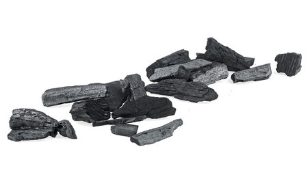 Charcoal particles isolated on a white background. hardwood charcoal.の写真素材