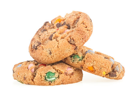 Sweet cookies with colorful candies and chocolate drops isolated on a white background. sugar cookies.の写真素材