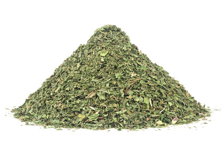 Pile of dried and chopped mint leaves isolated on a white background. Spicemint.の写真素材