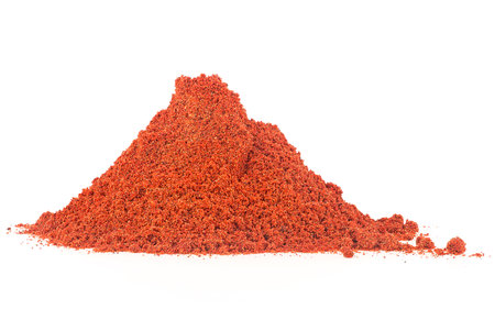 Pile of ground chilli red pepper isolated on a white backgroundの写真素材