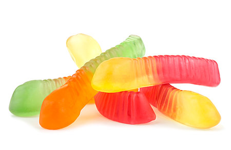Colorful jelly worms isolated on a white background. Gummy candies. Snakes.の写真素材