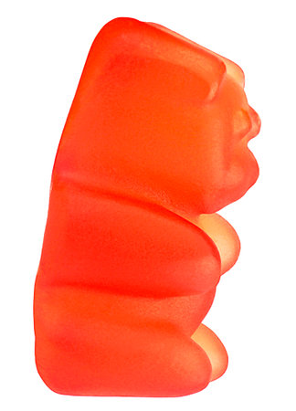 Single red gummy bear candy isolated on a white background. Sweet jelly bear.の写真素材