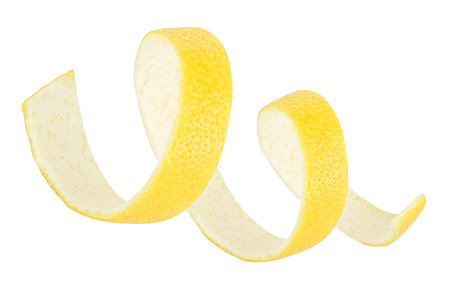 Spiral lemon twist isolated on a white background. Lemon peel or lemon skin.の写真素材