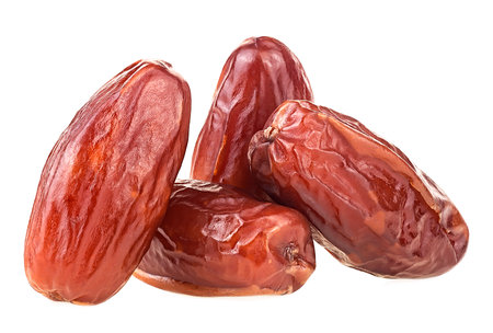 Pile of tasty dried dates isolated on a white background. Natural organic food.の写真素材