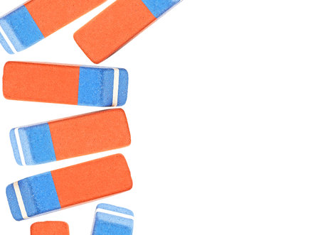 Classic pink and blue erasers isolated on a white background with copy space. Top view.の写真素材