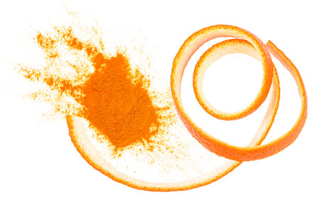 Dried orange powder with fresh orange zest isolated on a white background, top view.の写真素材