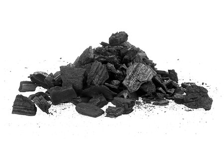 Pile of charcoal pieces isolated on a white background. Xylanthrax.の写真素材