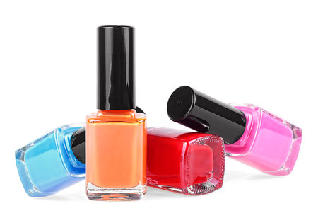 Bottles of colored nail polish isolated on a white backgroundの写真素材