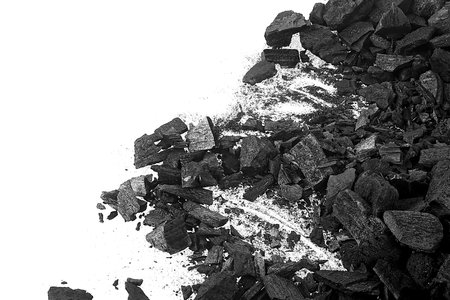 Pieces of hardwood charcoal isolated on a white background