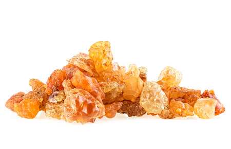 Golden frankincense resin isolated on a white background. Incense.の写真素材