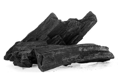 Pile of natural wood charcoal isolated on a white background. Hard wood charcoal.の写真素材