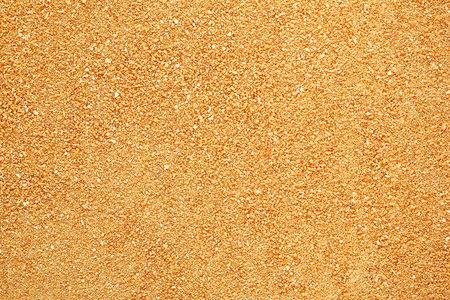 Pile of dried orange peel powder as backgroundの写真素材