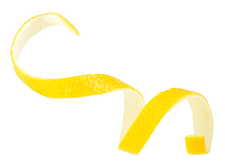 Fresh lemon peel on a white background. Citrus twist peel. Healthy food.の写真素材